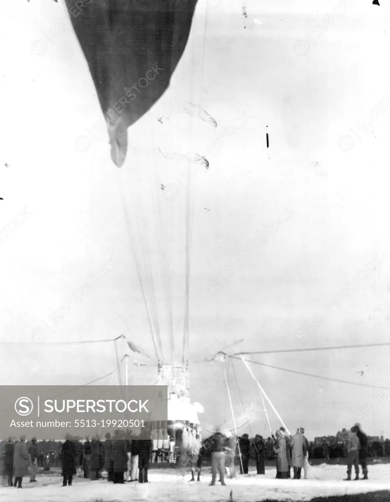 Piccards Off For Stratosphere -- Close to 250 men were in the ground crew that prepared the stratosphere balloon of Prof. and Mrs. Jean Piccard at Detroit, Mich., for their long flight into the upper air. The picture shows the crew about to release the balloon early on the morning of Oct 23, at the ford airport, near Detroit. The balloon soared eastward and landed near Cadiz, Ohio. Neither the Piccards nor their instruments were injured. October 23, 1934. (Photo by Associated Press Photo).