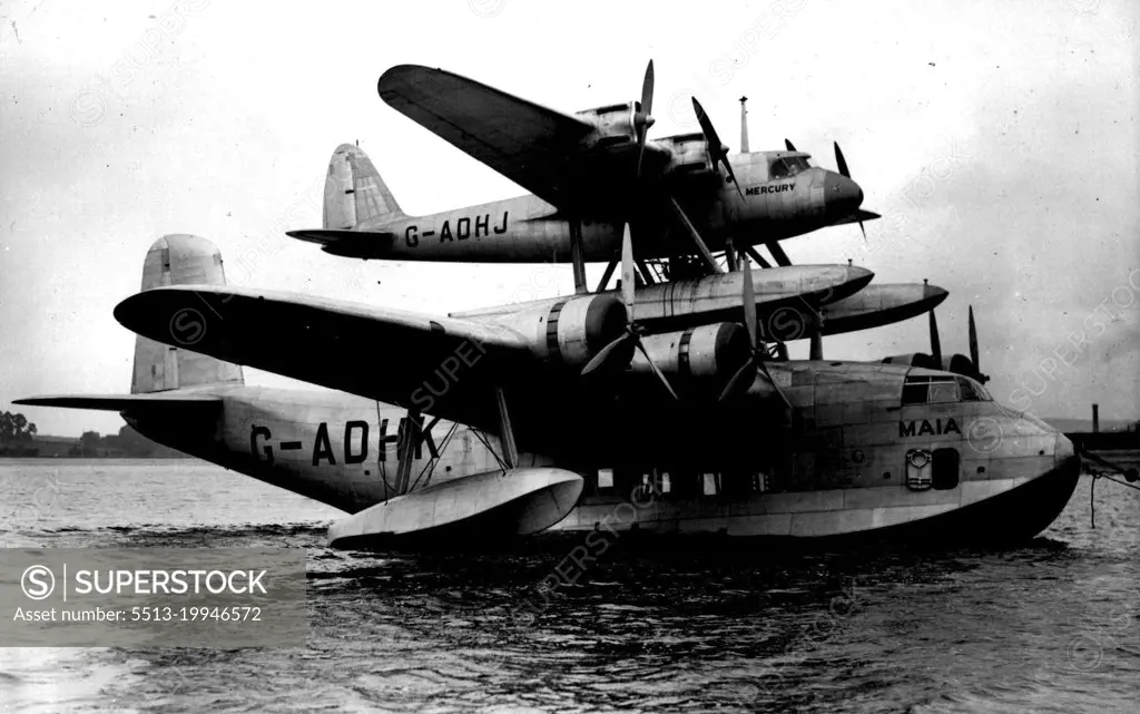 "Pick-A Back" Plane Ready -  The Mayo-Composite aircraft joined together for the first time seen on the Medway, at Rochester.The Mayo-Composite Aircraft, is now complete on the Medway at Rochester.The two planes, the four-engined sea-plane "Mercury" and its parent plane the 3,350H.P. Flying-Boat "Maia", are now in their positions, one fixed on top of the other, for the first time. This "pick-a-back" plane, brings India and New York within a day's non-stop flight, has a range of 3,500-4,000 miles without landing, and is the first aerial tug the world had known. October 12, 1937. (Photo by Sport & General Press Agency Limited).