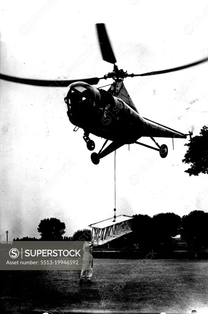 Aerial Crane. The "Westland Sikorsky," the first commercial-type helicopter available in Europe demonstrates how it can drop its own hoisting gear and while hovering, pick up a steel girder, offering an easy method of bridging a river from the air. The aircraft accommodates a pilot and three passengers in a luxury cabin, air-conditioned and warmed. June 1, 1947. (Photo by Sport & General Press Agency, Limited).