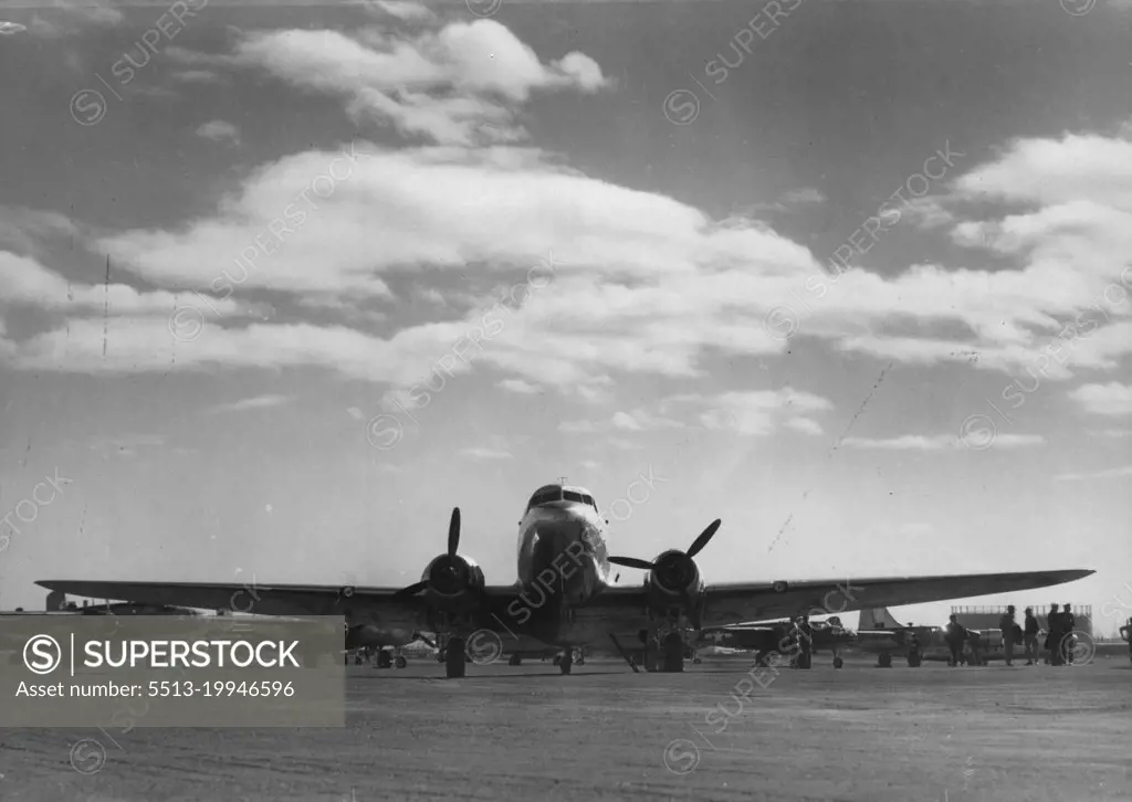 D.C.3 aircraft at Mascot prior to departure on first flight of Sydney-New Gunea service. April 2, 1945. (Photo by Richard McKinney, Qantas Empire Airways Limited).