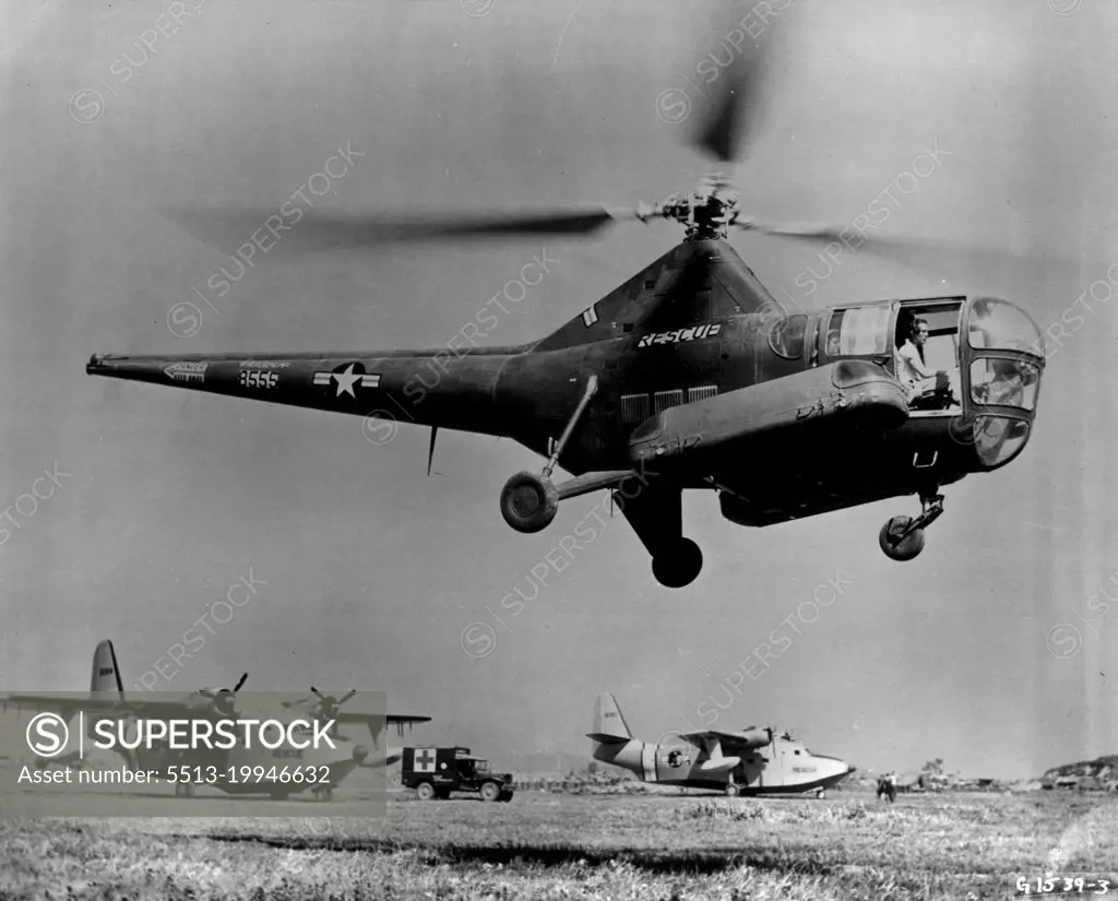 Two Types Of Rescue Aircraft -- Two types of 3rd Air Rescue Squadron aircraft are shown here. The H-5 helicopter in the foreground is used primarily to pick up downed crewmen and wounded personnel from Frontline areas as well as behind enemy lines. In the rear are SA-16 amphibians which are used in rescuing UN personnel downed at sea. Over 4800 rescues have been made by these rescue aircraft during the two years of the Korean war. June 21, 1952. (Photo by U.S. Air Force Photo).