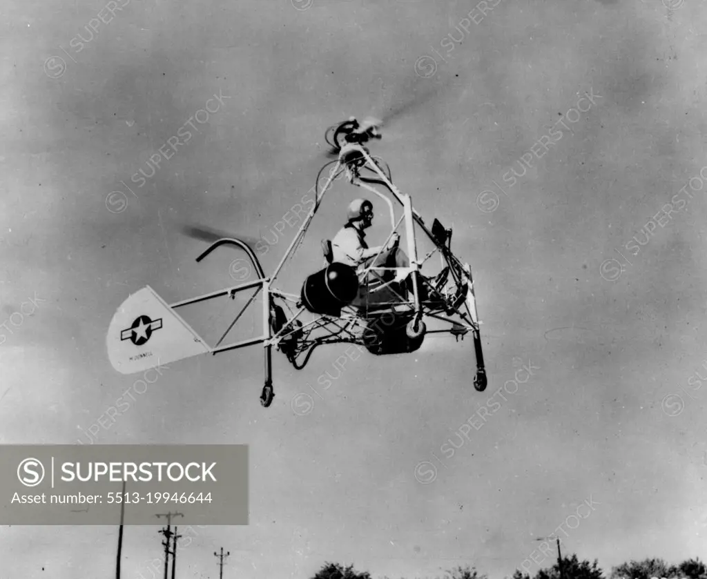 Helicopter Motorcycle In Flight -- The Air Forces' New Helicopter motorcycle, powered by ram jet units to spin the rotor blades, makes a test flight at the St. Louis, Mo., plant of the McDonnel Aircraft corporation. The craft eights only 310 pounds but has lifted an additional load of 300 pounds and moved at a speed of 50 miles an hour. November 15, 1947. (Photo by Associated Press Photo).