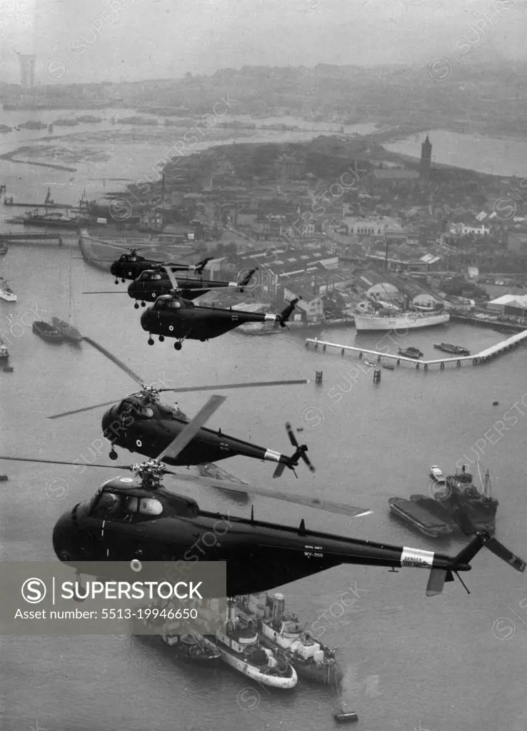 Navy's Anti-Sub Hoverplanes -- Helicopters of Number 845 squadron - the Royal Navy's first anti-submarine helicopter squadron - flying over shipping in the Solent today. The Squadron went into operational service at Gosport yesterday. The America-built Sikorsky's 55's known in the Navy as Whirlwinds, are similar to these now with the Navy in Malaya. Their anti-submarine equipment includes "dipping asdic". The squadron is expected to be based at Malta in the early summer. The helicopters are powered by Wright Cyclone engines. Eventually it is intended to replace the $55 by the twin engined helicopter Bristol 173. March 16, 1954. (Photo by Herbert Ludford, United Press Photo).