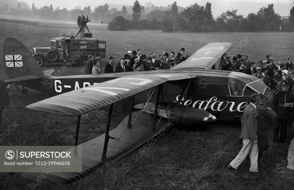 Mollison Machines Crashes - The machine after it had crashed.Mr. and Mrs. Mollison, crashed in their aeroplane, Seafarer, at Croydon. The machine, heavily laden with petrol, had only gone a few yards, along the ground, when they were starting on their great adventure of a double Atlantic flight, when it crashed and the under-carriage was completely smashed. July 17, 1933. (Photo by Central News).