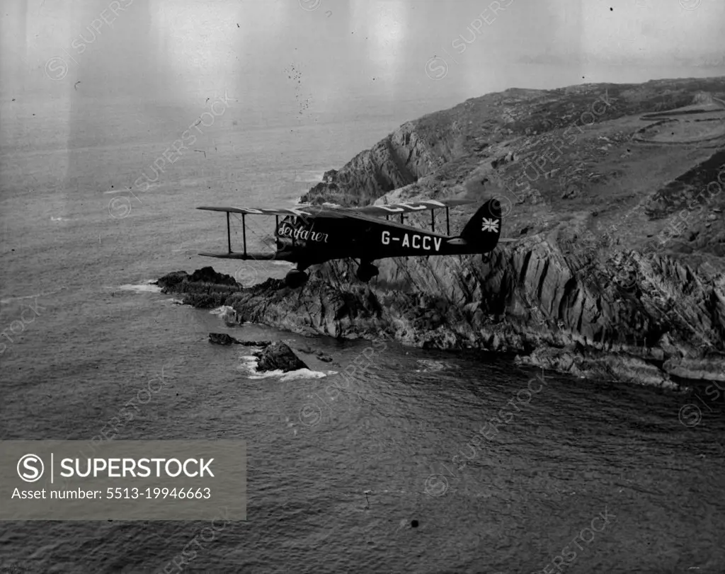 The Mollison Flight - Air Views as "Seafaber" Crosses Ireland -- The Seafarer passing Toe Head, Co. Cork.A series of Aerial views taken from an accompanying aeroplane, showing "Seafarer" with Mr. and Mrs. J.A. Mollison abroad, passing the Irish coast en route for a America, over the Atlantic. They succeeded in the crossing but unfortunately crashed at Bridgeport Connecticut. Both are now in Hospital. July 25, 1933. (Photo by Associated Press Photo).