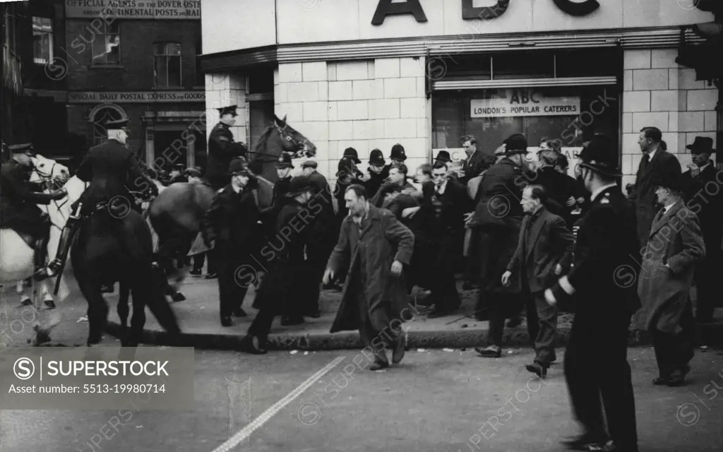 Dockers Trail At The Old Bailey -- Mounted and foot police clearing demonstrators during the disturbances, outside the court.Disturbances Outside Court. Disturbances took place outside the Old Bailey in London, during the closing stages of the trial of the seven clock-workers accused of illegal conspiracy to incitement men to take part in illegal strikes. April 17, 1951. (Photo by Sport & General Press Agency, Limited).