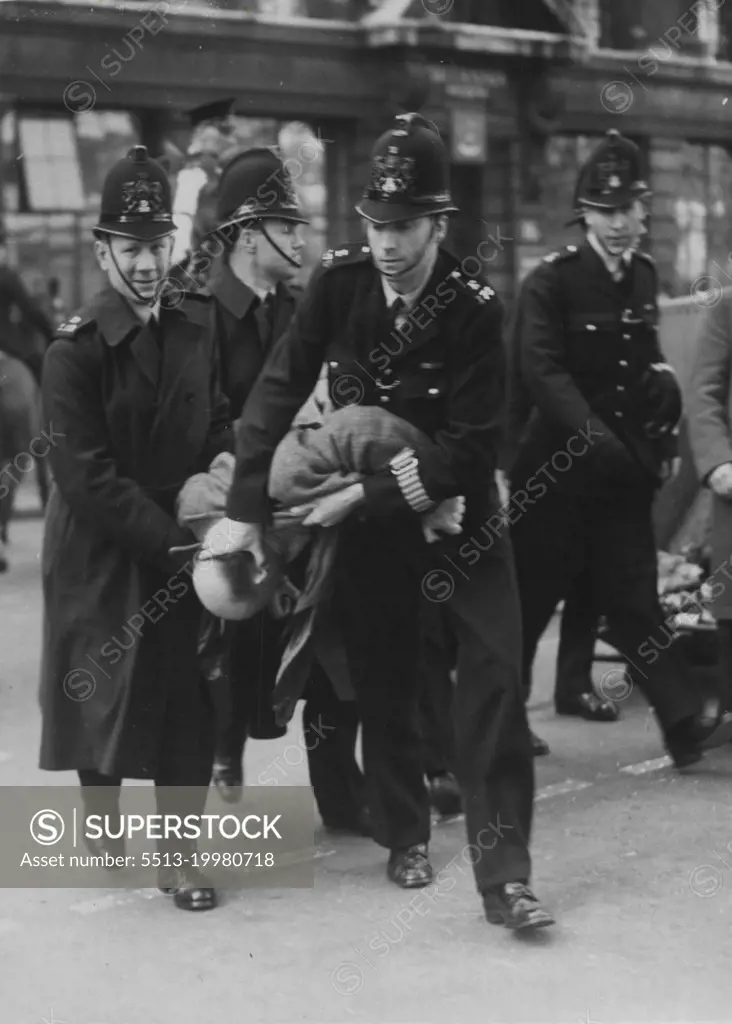 Dockers Clash The Police At Dock Strike Today -- During the closing stages of the trial of the London and Liverpool dockers at the Old Bailey this afternoon a number of London dockers who have staged a strike in protest against the arrest and trial, gathered outside. They clashed with a force of City of London police and a number of arrests were made. April 17, 1951. (Photo by Daily Mirror).