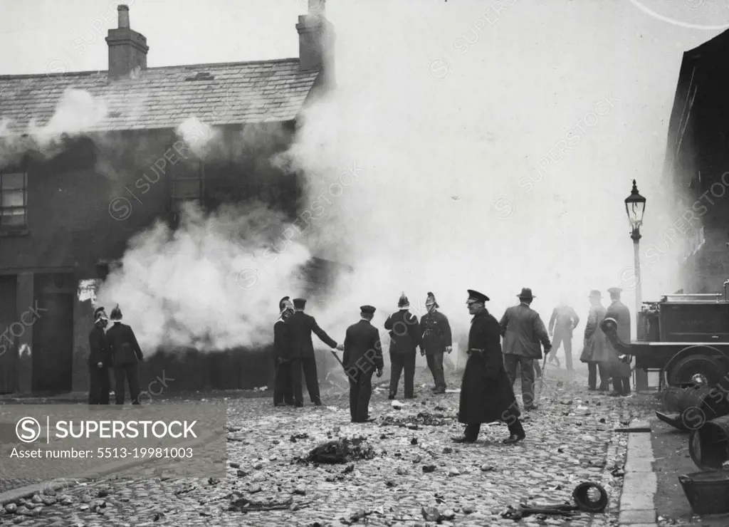 The Riots in Belfast -- The burning of a looted shop off York Street. November 21, 1932. (Photo by Central News).