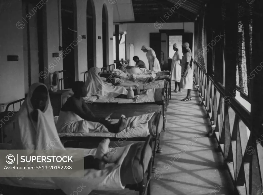 Zanzibar Hospital -- Matron on her daily tour of inspection of wards. She stops in the woman's ward to ask how the patients are this morning. September 01, 1951. (Photo by British Official Photograph).