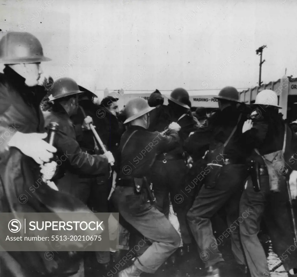 Deputies Drive Back Film Demonstrators -- Deputy sheriffs and police officers Drive Back paraders who demonstrated at Metro Goldwyn-Mayer studio today and engaged the officers in a battle which resulted in a dozen arrests and injuries to a number of participants on both sides. December 1, 1946. (Photo by AP Wirephoto).