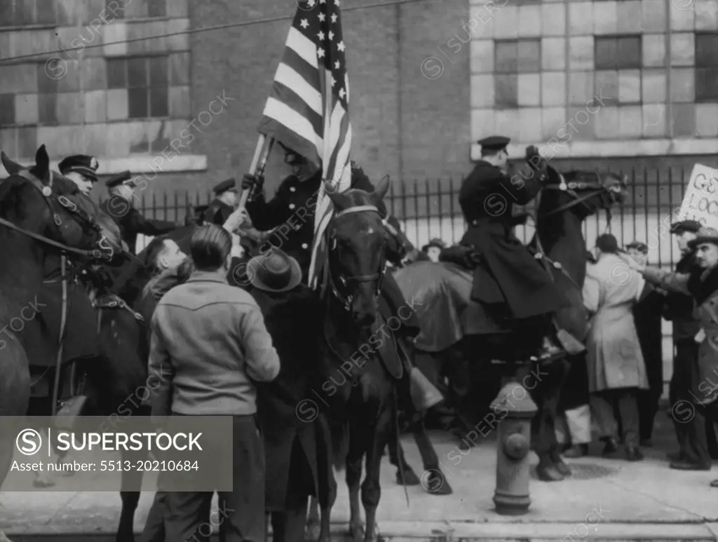 Picket - Police Flag Scuffle -- Mounted police and pickets wrestling for flag in front of Philadelphia's General Electric Co. plant today. A melee broke out as police on horseback charged massed pickets in an effort to enforce a court injunction limiting picket demonstrations in front of the plant. Six men were arrested and one injured in the picket line scuffle. February 27, 1946. (Photo by AP Wirephoto)