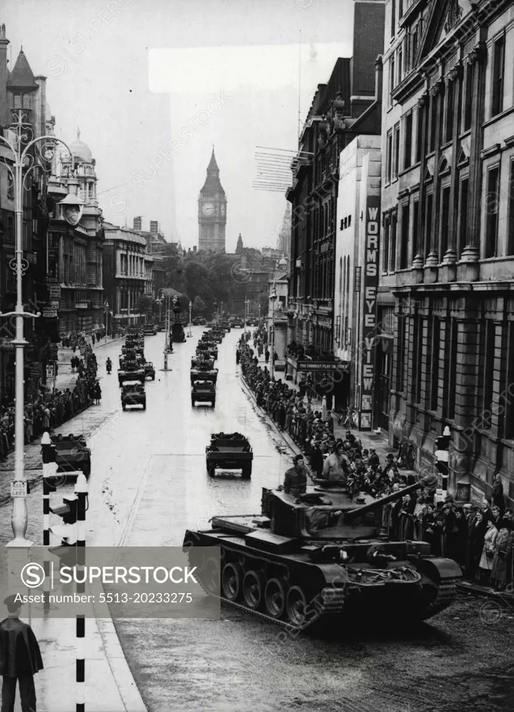 London Sees Victory Parade Rehearsal -- The early morning crowd watching the mechanised procession coming up Whitehall into Trafalgar Square. In the background rises the tower of Big Ben.Londoners turned out early on the Sunday preceding Victory Day to watch a full dress rehearsal of the mechanised part of the Victory Parade. June 02, 1946.