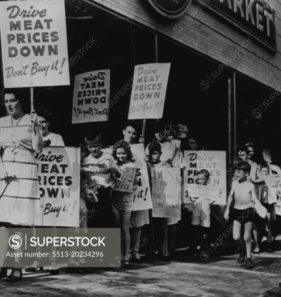 Picket for lower meat prices. Housewives and children are shown (above) picketing a chain store here today in an attempt to reduce week-end meat purchases in a protest against higher prices. July 19, 1946. (Photo by AP Wirephoto).