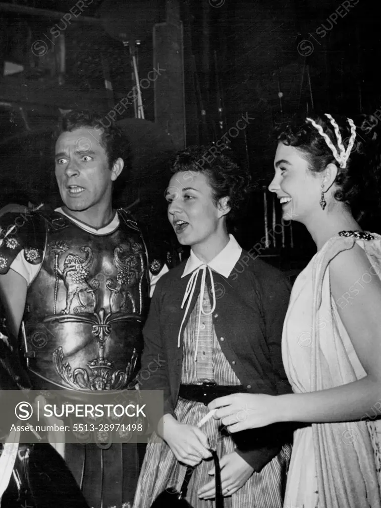 Burton with his wife Sybil 24 center and Jean Simmons on set