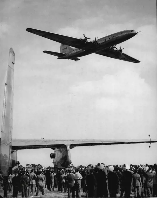 Brabazon' Flies Over Farnborough -- The Brabazon flying over a Handley Page Marathon I (on the ground) at Farnborough to-day. The world's largest civil landplane, the 130-ton Bristol 'Brabazon I', flew over Farnborough Aerodrome, Hampshire, to-day (Thursday), making a low-level run down the full length of the field. The 'Brabazon', which made her maiden flight only last Sunday, had flown from Filton, Bristol, to Farnborough, where the tenth Flying Display and Exhibition organized by the Society