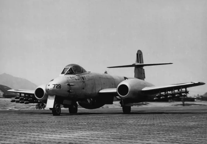 Taxying flown the tarmac before taking off from Kimpo which was one of the squadrons bases in Korea, this Meteor Jet fight of No. 77 Squadron RAAF is armed with sixteen death-dealing rocket projectiles. Within a short period after this picture was taken, this aircraft had strafed and raked Communist target with rockets and cannon shells. January 12, 1955. (Photo by RAAF Official Photo).