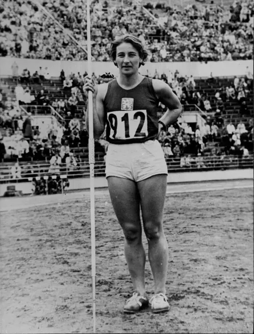 Zatopek's Wife Also Wins Olympic Gold medal -- Dana Zatopkova, wife of the Czech runner (who has so far won the 10,000m and 5,000m) pictured after she had also won a Gold Medal in the Olympic Games at ***** yesterday with a record javelin throw of 165ft 7ins. Sturdy Czech Mrs. Dana Zatopek, who won the Olympic women's javelin throw with a record of 165ft 7in. She is the wife of champion distance runner Emil Zatopek, who won three titles at the Games. July 25, 1952.