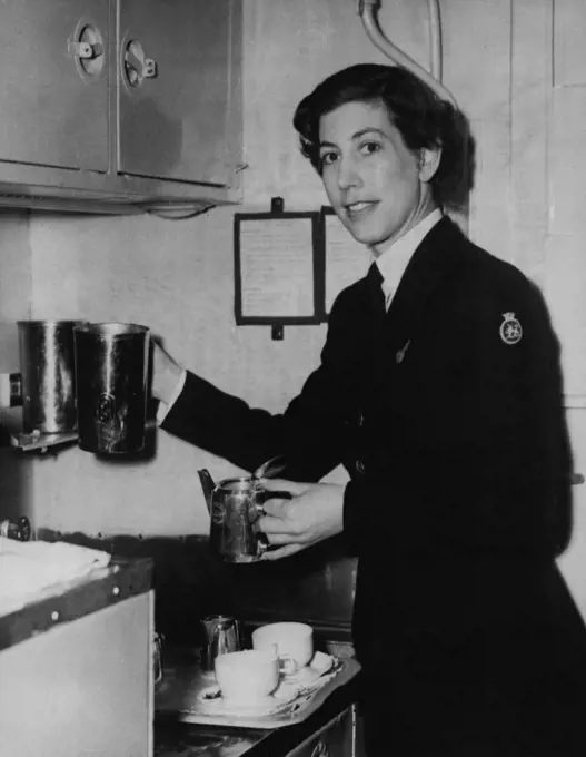 Princess's Stewardess -- Shown at work in her airborne galley is Stewardess Jean Gordon, 30, of Beaconsfield, Buckinghamshire, who will be one of the crew of 11 of the British Overseas Airways Stratocruiser in which Princess Elizabeth and the Duke of Edinburgh will fly form London Airport on October 7 to begin their Canadian tour - delayed owing to the illness of the King. Miss Gordon is one of B.O.A.C.'s most experienced stewardesses with the reputed ability to 'soothe the most nervous passenger