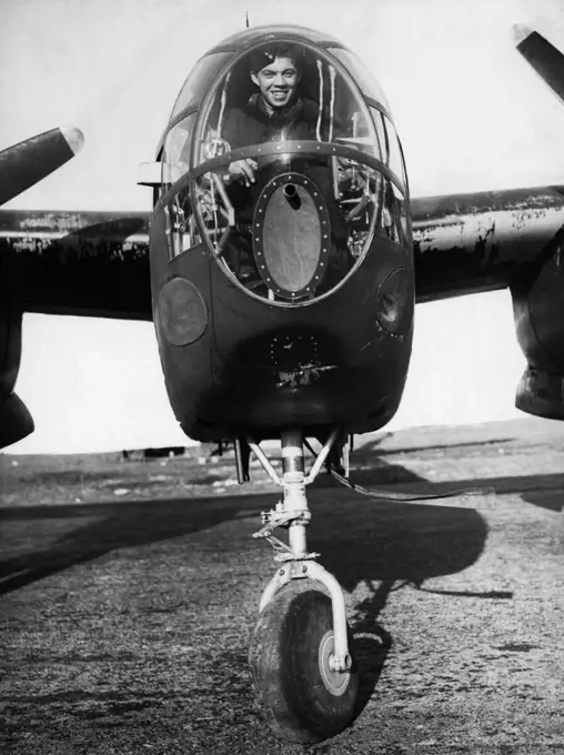 American War Planes In England -- The bomb-aimer's cockpit of the Douglas Boston III twin-engined bomber showing the front wheel of the tricycle undercarriage. War planes from the United States are arriving in England in a Steady flow. Heavy bombers are being "ferried" by air across the an Atlantic by both American and British Planes. Photographs taken at an aerodrome in England where many of the aircraft are overhauled before passing into service with the Royal Air Force. April 12, 1944.