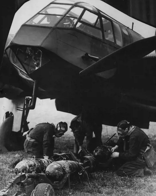 89C - Loading Bombs And Ammunition - Bombing Crew At Work, Gunners Etc. August 22, 1938. (Photo by Sport & General Press Agency, Limited).