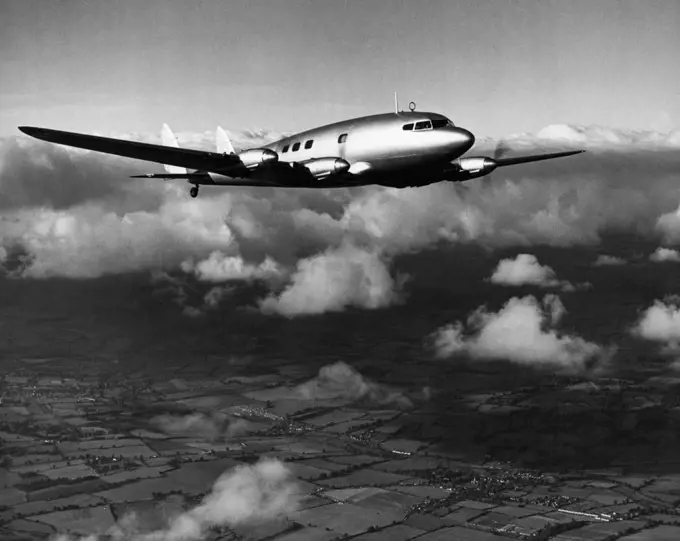 Britain's Newest Airliner -- Imperial Airways has ordered five de Havilland Albatross monoplanes (four Gipsy-Twelve 550 h.p. engines), each of them transporting approximately 20 passengers and a big load of mails. Cruising at considerably more than 200 m.p.h. (322 km./h.) the Albatross is to-day the world's fastest four- engined airliner. The photograph shows the first Albatross above the clouds at the start of "altitude" tests undertaken to check rate of climb, attainable "ceiling", and engine 