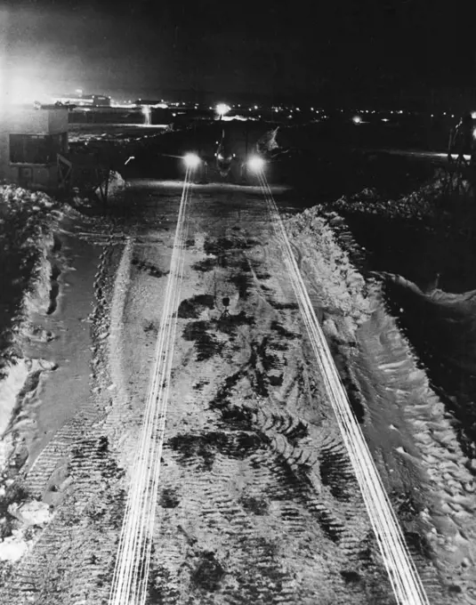 The Striking Power Of A U.S. Fighter -- Streams of tracer bullets pour from the wing-guns of a Curtiss Kittyhawk fighter plane in spectacular night demonstration of the craft's striking power. The demonstration was at one of Curtiss-Wright's plants in New York State, on the eastern U.S. seaboard. August 6, 1942.