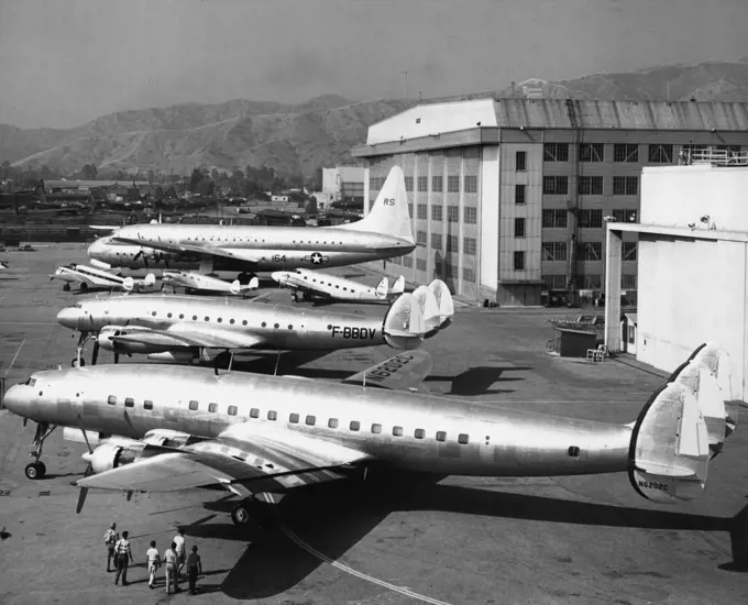 And Still They Grow -- How transport aircraft have grown in 18 years is illustrated in this "family portrait" released by Lockheed Aircraft Corporation today showing six models, ranging from old to new, of principal Lockheed airlines when all were in reunion at their home airport at Burbank, Calif. Since days of 1934 Electra, 1937 Model 14 and 1939 Lodestar (small planes, left to right), capacities have increased from 12 passengers to about 50 to 100 in modern Constellation types (two front ship