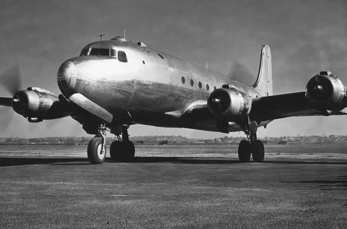 Tour Douglas skymasters of the type shown, will soon reach Sydney to enter the interstate passenger services of Australian national airways. December 27, 1945.