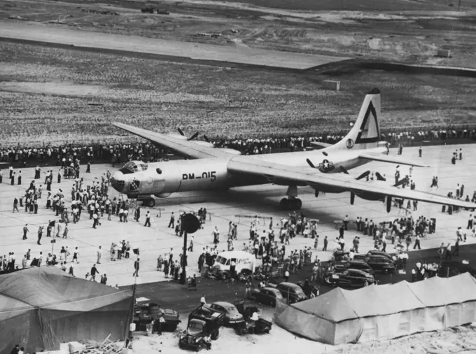 Largest Bomber at Greatest Airport -- People throng around the U.S. Air Force's B-36, the World's largest land-based bomber, at the dedication of 5,000 - Acre New York International Airport, N.Y.-- the greatest in the World. The mammoth comber took part in the air show, July 31, which was the nation's mightiest peacetime display of airpower. July 31, 1948. (Photo by Associated Press Photo).