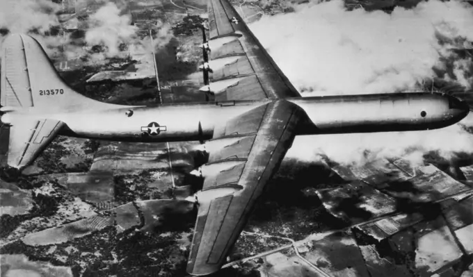 Round-Tripper for The World -- The Army Air forces said today that its new Six-engine B-36 bomber, shown on one of its test flights, "could carry an atomic bomb to any inhabited region in the World and return home without refueling in the event of an enemy attack." The AAF said production had started on the bomber which has been described as the Worlds largest. November 06, 1946. (Photo by AP Wirephoto).