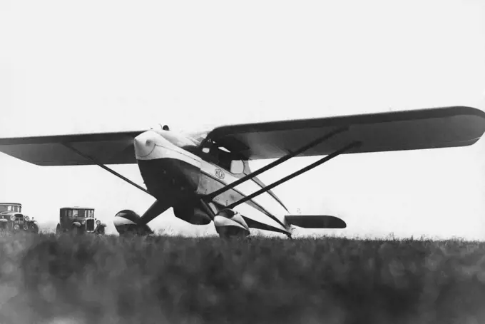 Flying With A Ford V. 8 Engine - The "Wicko" at Gravesend Aerodrome. Mr. C.N. Wilkner, an Australian from Brisbane, has designed and-is flying a two-seater light aeroplane powered by a Ford V. 8 Engine unit. The machine, which has American tendencies, in design, is called he "Wicko", and has a top speed of 115. m.p.h., cruises at 100 m.p.h., and lands at 59. m.p.h., It will be marketed at 375, This is the first time a Ford engine has been used in a light 'place in England. October 26, 1936. (Pho