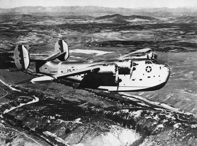 The U.S. Navy's Fighting Force Above The Sea - The Consolidated "Coronado" (PB2Y) is mightiest of the U.S. Navy's long-rango patrol bombers. It weighs 29 tons and is unofficially credited with a bomb-carrying capacity of six to eight tons, as great as the largest land bomber. It has a cruising range of over 5,000 miles. In every phase of naval action, aircraft plays a vital part patrol bombers range far out to sea on interception and bombing duty. Scout bombers spot and attack the enemy fleet a