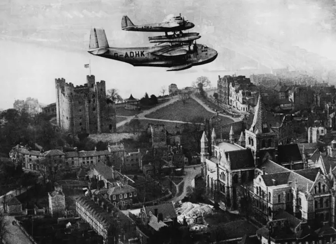 Mayo Composite Makes A "Separation" Test Flight -- The Mayo composite flying over Rochester Castle during the test flight today. The Mayo composite machine this afternoon made a test flight at Rochester, during which the machines parted in Mid-Air. February 23, 1938. (Photo by Keystone).