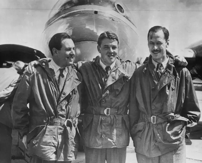 Crew Of Record Breaking Canberra -- The crew of the English Electric Canberra pose after Landing at the Olenn L. Martin plant here today. From left they are R.H. Rylands, R.P. Beamont, and D.A. Watson. The twin-jet Canberra Bomber set an East-West Atlantic crossing record last week. It made the 2,072.79-mile trip in four hours and 15 minutes. September 4, 1951. (Photo by AP Wirephoto).