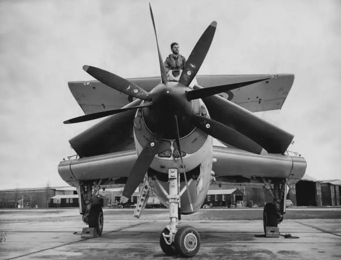 'Concertina' Plane Neatly 'packaged' and ready for stowing - Fairey Gannett with wings folded and with multi-bladed propeller at front at Ford to-day. The Navy to-day (Monday) formally received its first aircraft specially designed for anti-submarine duties - the Fairey Gannet - in a a ceremony at the Royal Naval Air Station, Ford, Sussex. Sir Richard Fairey, Chairman and Managing Director of Fairey Aviation, Limited, handed over log books of the aircraft and later watched a demonstration fly pa