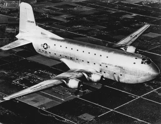 Giant Transport Like This One Missing On Atlantic Flight -- Shown above is a giant U.S. Air Force C-124 or Globemaster II. A plane of this type disappeared in bad weather today on a flight from the U.S. to England. The British Press Association reported there were 52 persons aboard the plane last heard from in a routine radio check 800 miles southwest of Ireland. Transport was en route from Limestone, Me., to the American base at Mildenhall, Suffolk, England. March 23, 1951. (Photo by AP Wirepho