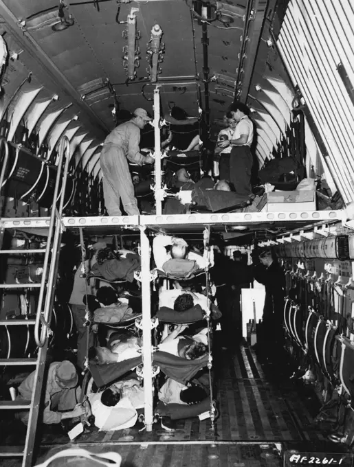 Double Deck Hospital Airplane Instead of having to wait at an airstrip in Korea for evacuation on smaller aircraft, nearly 100 Patients are loaded into a giant C-124 of the 374th Troop Carrier Wing/(Combat Cargo) and brought to Japan for further treatment at hospitals here. Because of its larger capacity, this U. S. Air Force Globemaster can bring back more men quicker, and get them started on the road to recovery faster. The spacious double-deck interior of the plane can carry as many patients