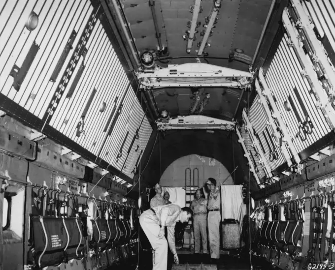 Roomy Interior The cavernous cargo hold of a U. S. Air Force C-124 "Globemaster II" demonstrates the vast cargo- carrying potential of the giant transport. Being tested under field conditions, and flying with other transports engaged in the Korean airlift by the Far East Air Forces 315th Air Division (Combat Cargo), the Globemaster will carry approximately 30 tons of cargo on a single flight in the Korean airlift, more than three times the amount carried by the C-54 Skyraaster, previously the la