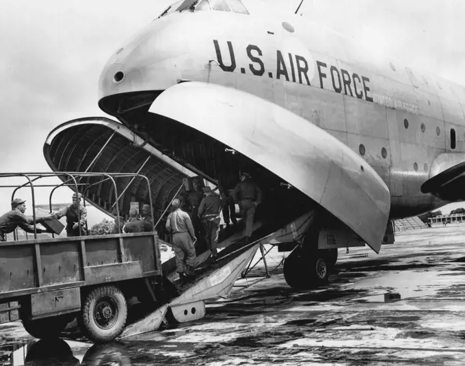 U.S. Air Force C-124 Globemaster is Unloaded in Flood-Stricken East Pakistan The first U. S. Air Force C-124 Globemaster of the Far East Air Forces' 374th Troop Carrier Wing, from Tachikawra Air Installation near Tokyo, Japan, to land at Dacca, East Pakistan, Aug. 16, is unloaded by U. S. Army personnel of the 37th Medical Preventive Medicine Company. United States aid, in the form of medical supplies and personnel, was airlifted to East Pakistan to assist the 7,000,000 flood victims isolated by