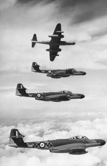 Meteors of the Air. A striking picture of four Meteor N. F. 14 Night Fighters in a formation flying exercise over southern England. One of the first pictures to be released showing the latest and fastest version ***** the famous "Meteor" jet fighter to be produced - the Mark N.F. 14 Night Fighter now in R.A.F. Squadron service. This aircraft was recently described by the Air Minister as "the most effective night fighter that exists". June 27, 1954. (Photo by Sport & General Press Agency, Limited