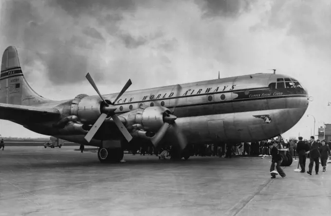 London Sees World's Largest Airliner People dwarfed by the huge bulk of the Stratocruiser at London Airport today. The world's largest and fastest commercial landplane, the Pan American World Airways America-Class Clipper 'Flying Cloud ' arrived at London Airport today (Monday) after her maiden crossing of the Atlantic. One of the Boeing Stratocruisers to enter the New York London service, the double-decked 71-ton aircraft accommodates 75 passengers. It is 110 feet 4 inches long, has a wingspan 