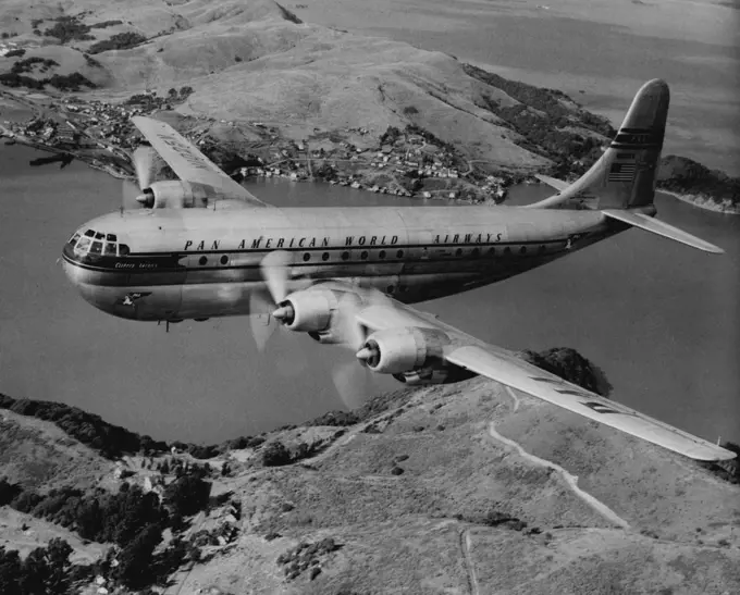 New Luxury Service To U.S.: - Pan American World Airways "Strato" Clipper, called the world's "fastest and most luxurious" commercial passenger plane. These giant airliners will be used on Pan American's new luxury air service to the United States, The doubledecked "Strato" Clippers carry 56 passengers with individual Sleeperette seats or single-occupancy berths for each, A club lounge on the lower deck, reached by a spiral staircase within the plane, offers complete bar service. The huge Clippe