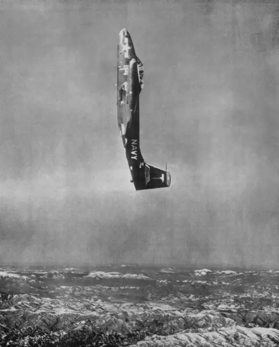 Straight Up! A Banshee jet fighter from Fighter Squadron II, the "Red Rippers", climbs straight up skyward over the rugged snow-covered terrain of North Korea. The "Red Rippers" squadron from Jacksonville, Fla. is flying form the carrier USS Kearsarge in Task Force 77. March 08, 1953. (Photo by U.S. Navy Photo).