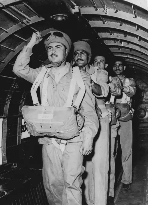 Egyptian Paratroopers In Training. Paratroopers of the newly-formed Egyptian parachute Brigade, lining up inside a training plane just before making a practice jump. June 16, 1952.