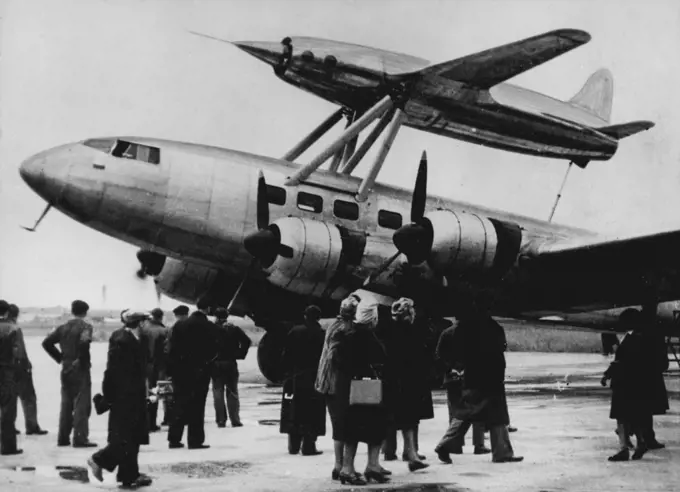 First French Jet-Propelled Plane Tested -- An experimental jet-propelled plane - the first constructed in France - Rests atop the French four-Motored plane "Languedoc" Oct. 21 before being taken up 9,000 metres for its first flight. The French engineer Leduc, who designed this jet plane, said the test was successful. The flight was made from the Francazal Airfield, toulouse. In this photo the pilot is already in the jet plane, called "Leduc ready for the take-off. October 24, 1947. (Photo by Ass