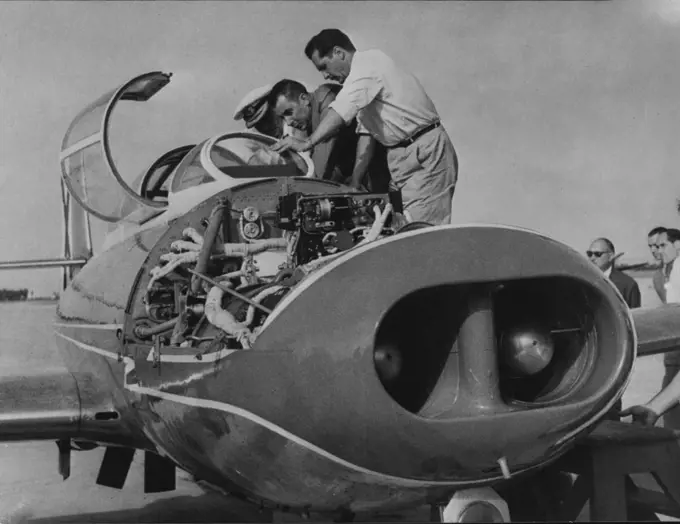 Spain's First Jet Plane: The Spanish air minister, Lt. General Gonzalez Gallarza inspecting the plane before it took off. The first jet plane to be made in Spain-the "Saeta Ha.A - 200Rl - was given its first test flight over San Pablo this week. August 18, 1955. (Photo by Paul Popper Ltd.).