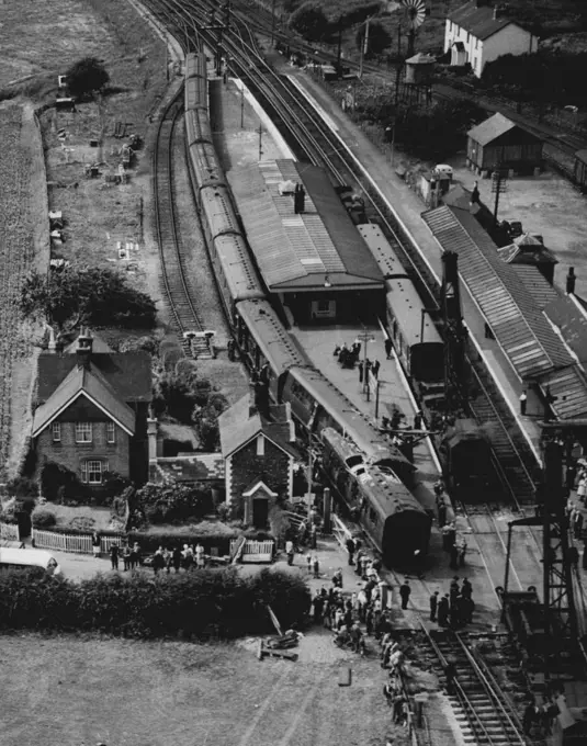 8 Dead, 47 Injured in Train Smash - View from the air of the scene after the crash, with telescoped coaches in foreground. Eight persons were killed and 47 were injured when two trains were in collision to-day (Sunday) at Ford Junction, near Arundel, Sussex. The 11.17 a.m. Brighton to Portsmouth train was in collision with the rear of a stationary Three bridges to Bognor train. One of coaches of the Portsmouth-bound train and the end coach of the stationary train were telescoped. August 5, 1951.