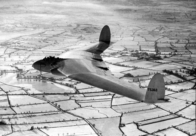 The Flying Wing. Only the hot effluzes from its twin Rolls-Royce Nene turbo-jets relieved the wintriness of the scene as the A.W. 52 research aircraft went on its flight. The first aerial photographs of the new Armstrong Whitworth flying-wing (the A.W52), which has rolls-royce Nene jet units, were taken over Warwickshire during the recent snow. July 15, 1948. (Photo by L.N.A.).