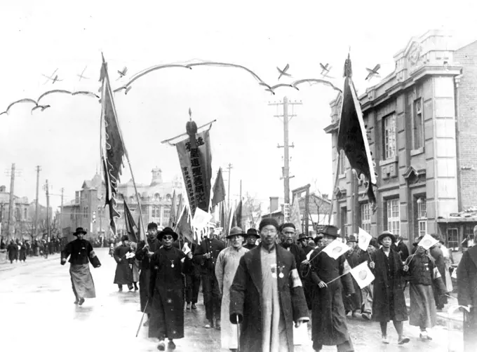 Anti-League of Nations parade staged in Mukden recently. Residents of the Manchurian capital are seen carrying Japanese banners and flags. January 14, 1932.;Anti-League of Nations parade staged in Mukden recently. Residents of the Manchurian capital are seen carrying Japanese banners and flags.