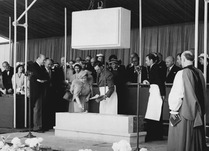 Queen Lays Foundation Stone Of National Theatre -- The scene at the site of the South Bank between the Royal Festival Hall and Waterloo Bridge this morning, when H.M. The Queen laid the foundation stone of the National Theatre. Princess Elizabeth is seen behind the Queen, and the Archbishop of Canterbury on the right. August 09, 1951.;Queen Lays Foundation Stone Of National Theatre -- The scene at the site of the South Bank between the Royal Festival Hall and Waterloo Bridge this morning, when H